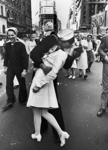 the line refers to a classic photo of a soldier arriving home from the war